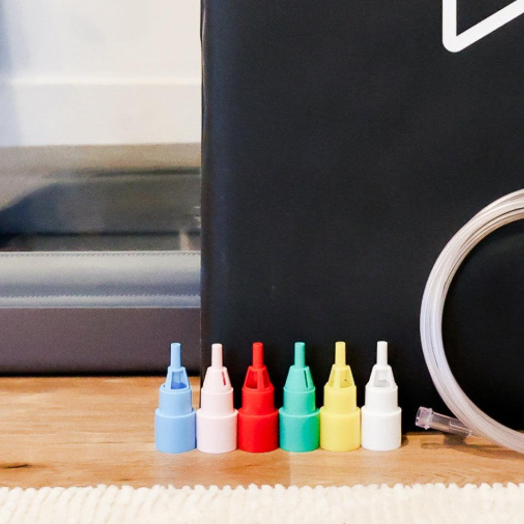 Venturi Oxygen Kit layed on the ground next to pet oxygen chamber